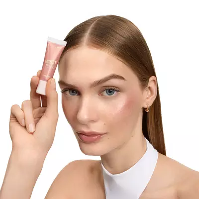 A model holding a Juicy Tube